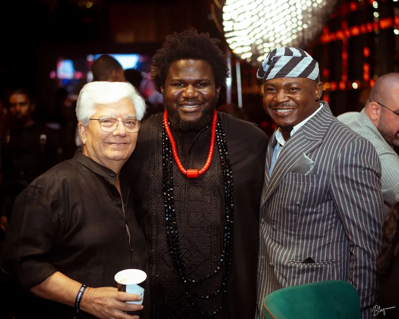 The Corporate Emcee smiling with two guests at World Class Nigeria 2026